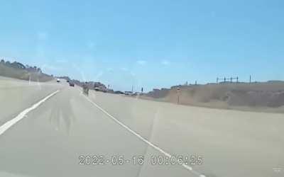 Bike turns in front of cammer