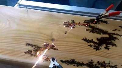 Electricity finding the path of least resistance on a piece of wood