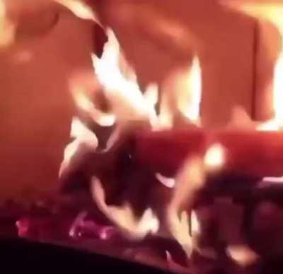 Putting corn on a fire