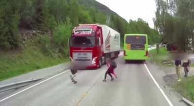 Never cross the road from behind the vehicle!