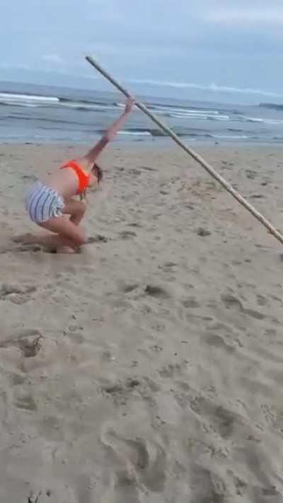 Pole vaulting on beach......