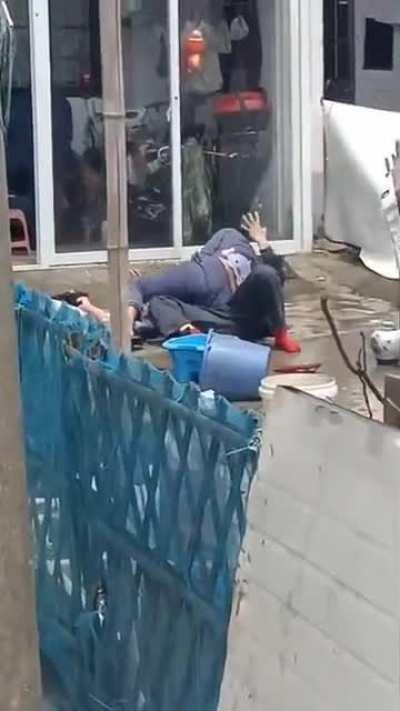 Neighbors fighting by throwing buckets of shit