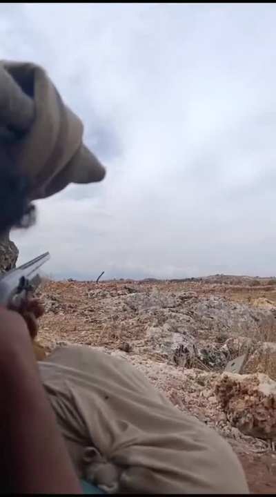 A soldier from the Syrian opposition forces fires a shotgun against a Syrian Arab Army FPV drone in the Idlib region. Probably November 2024