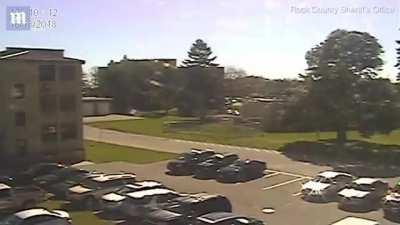 Handcuffed teen makes his escape from a police station by diving headfirst through the window