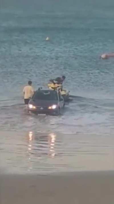 Man literally tries to put jetski into water with a Peugeot 208