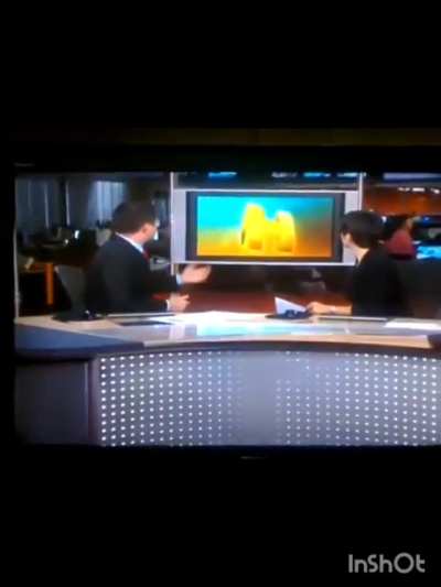 Reporter is pushed by two crazy guys while reporting news to a TV channel (Brazil).