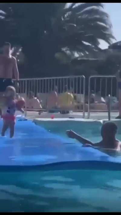 Ababy is about to dive into the water, be careful!