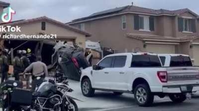 Car flying into garage