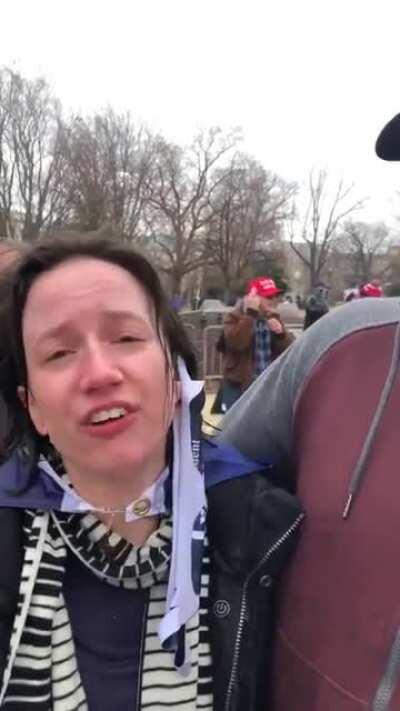 So turns out this lady didn’t get maced. If you look closely, she’s squeezing an onion in her towel against her eyes.