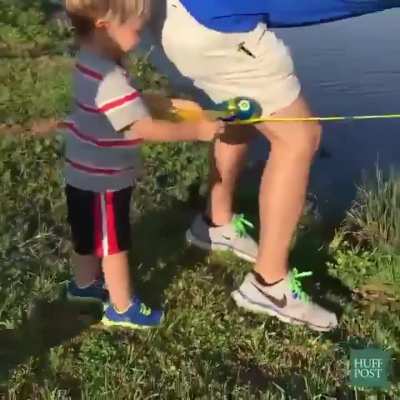 The father doesn’t intervene or take the rod.. he lets the child feel the thrill of success all on his own