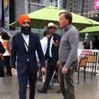 Racist guy heckles and confronts a turban-wearing Sikh he mistook for a Muslim, who keeps remarkably cool as security guards lead the man away
