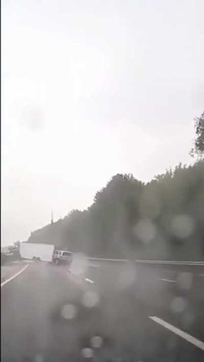 Eyes on the road - Driver plows into trailer at high speeds during rain on highway