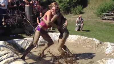 Girl dominates her opponent in mud wrestling
