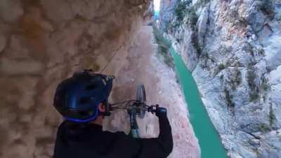 High-speed mountain biking down the side of a canyon.