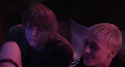 Ruby O. Fee dancing topless in a strip club