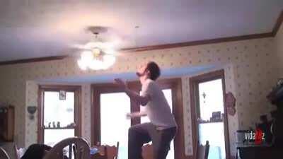 Guy tries grabbing a tomato between spinning fan blades