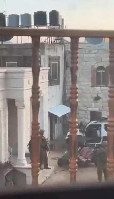 The Israeli occupation forces detain a Palestinian youth after raiding his home in Turmusayya village, and brutally abuse him.