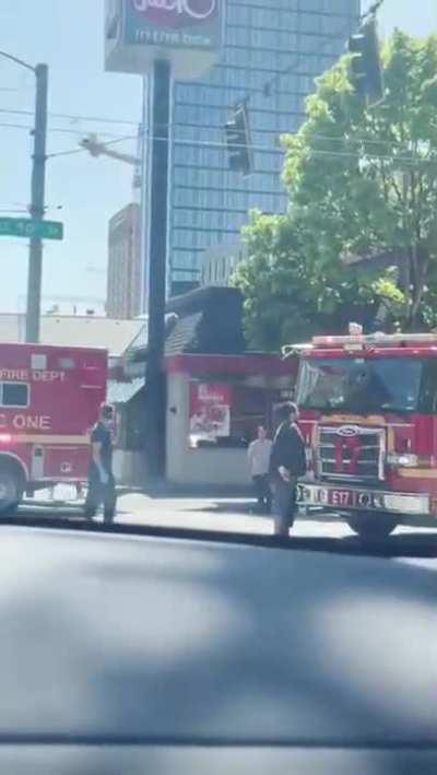 Main character standing in front of a firetruck and blocking it.