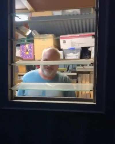 Wife spooks husband through window