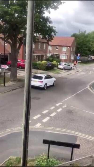 After what seemed to be a fairly calm confrontation between two Brits, one man sends another man flying after hitting him with his car.