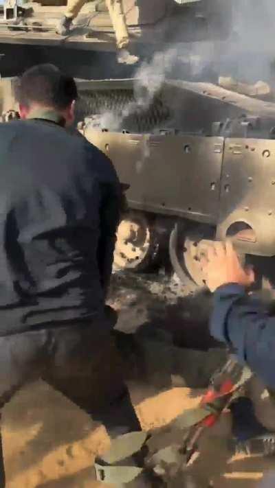 Israeli soldier pulled out of burning Merkava