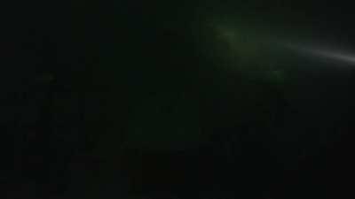 4 skeletons sitting at a table deep down under the sea