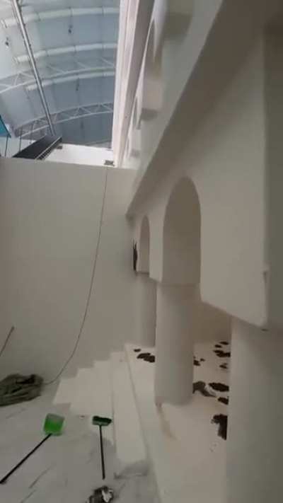 Deep multi-level indoor pool drained for maintenance