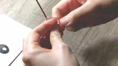 Time-lapse of making a tree armlet with copper wire and a gemstone. It took about two hours.