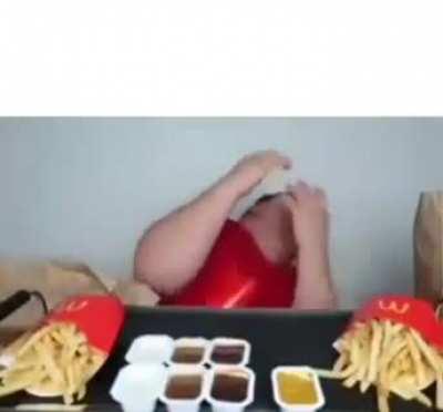 Films himself getting pelted with empty fries packs and acts like its genuine on camera drama