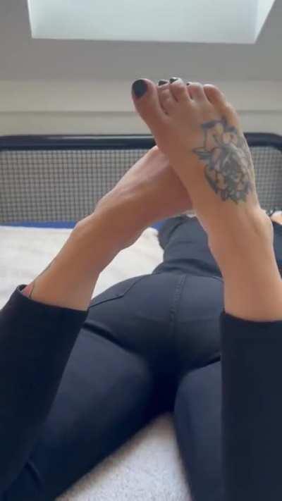 Crossed feet and black nail polish - relaxing a little before getting back to crushing 😈