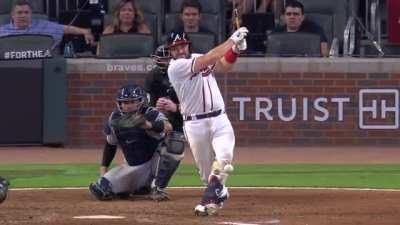 MLB player's bat hits the baseball a second time after breaking.