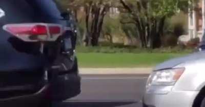 Yelling at protesters instead of focusing on the road