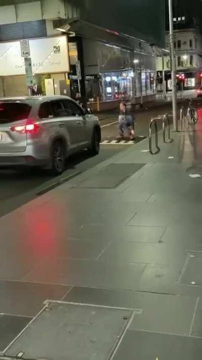 Man walks in the middle of the road