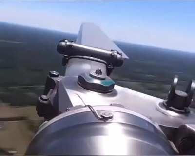 Slow motion footage of a helicopter main rotor blade in action.