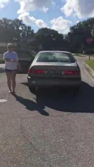 Unhinged Karen loses her mind and tries to run over a group of teenagers with her car for riding their hoverboards in their neighborhood.