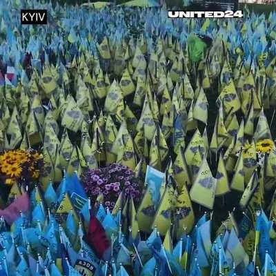 A place in Kyiv where people bring flags to commemorate the victims of Russian aggression