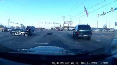 Idiot blows through red light and hits & flips an SUV carrying an entire family right in front of me.