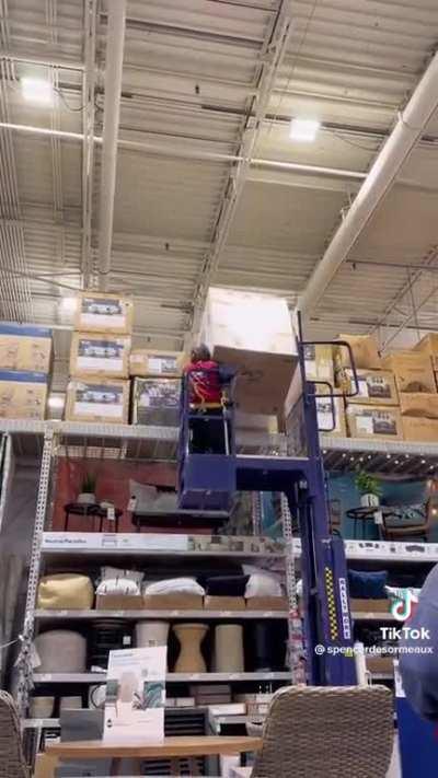 Lowe's employee takes down a box