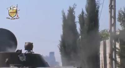 Opposition fighters using a captured BMP-1 to lob 2A28 Grom shots at Syrian Army positions - Adra - 6/11/2013
