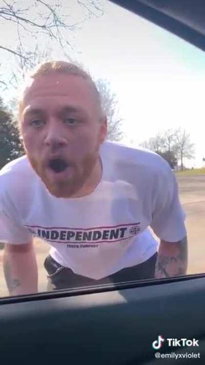 Crazy possessive man tries to get into a woman’s car even though she says she wants him to leave her alone