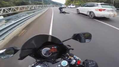 Speeding biker girl hits guardrail and gets thrown off her bike like a ragdoll