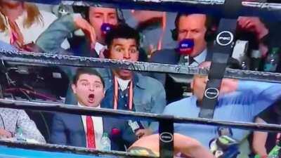 Man in front row reacts to devastating KO
