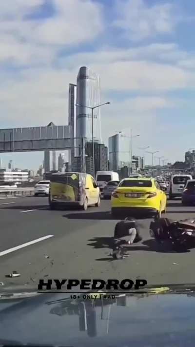 Biker side swipes a car mirror and is swiftly introduced to karma.