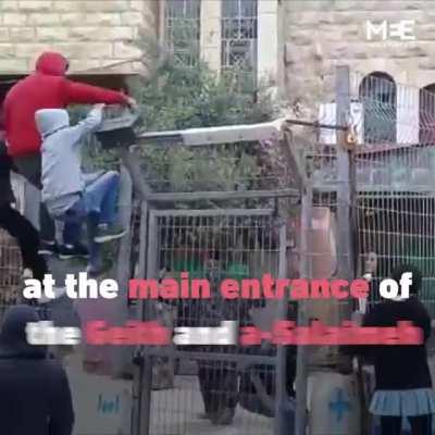 Palestinian school children fenced off from parents