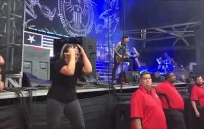 Sign language interpreter at a metal concert