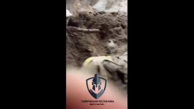 Ukraine soldiers sitting in muddy trench taking cover from incoming artillery