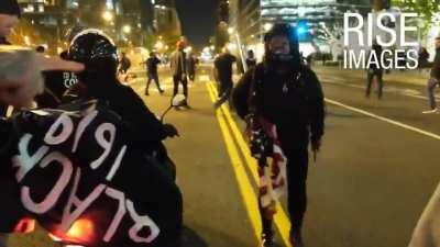 Female protestor pulls a knife and gets knocked out