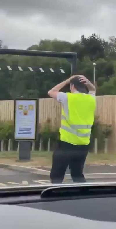 McDonald's worker entertaining people waiting in long lines for their first burgers in weeks