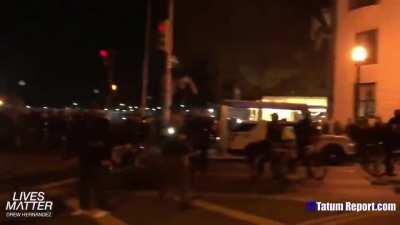 Antifa/anarcho-Democrats/Black Lives Matter protestors rob, vandalize, and destroy a black man's sidewalk-shop selling MAGA merchandise