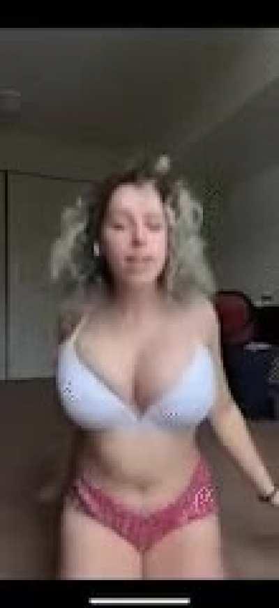 Bouncing her huge tits while wearing lingerie